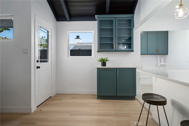3533 Deerford St, Lakewood, CA 90712 - interior space with light wood-style flooring, light countertops, glass insert cabinets, and green cabinetry