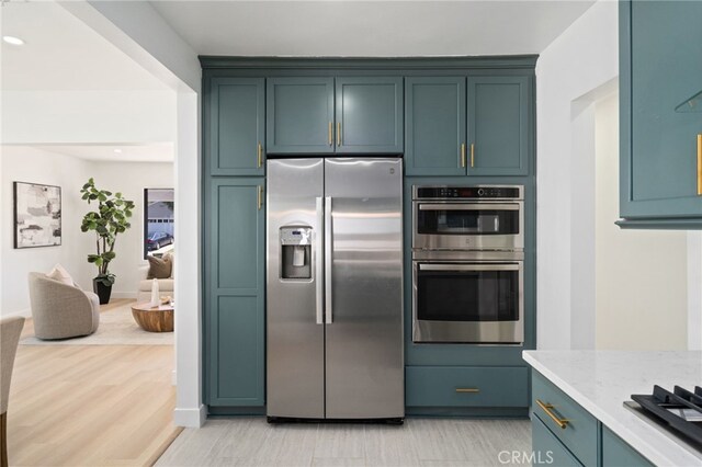 3533 Deerford St, Lakewood, CA 90712 - kitchen featuring stainless steel appliances and light stone counters