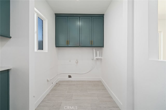 3533 Deerford St, Lakewood, CA 90712 - washroom featuring baseboards, gas dryer hookup, hookup for a washing machine, and cabinet space