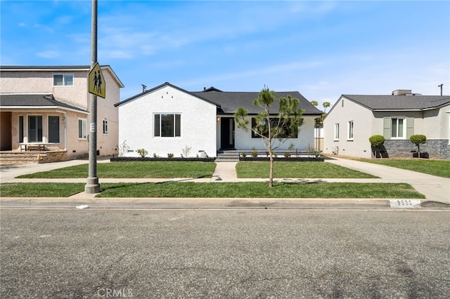 3533 Deerford St, Lakewood, CA 90712 - view of front facade with a front yard and stucco siding