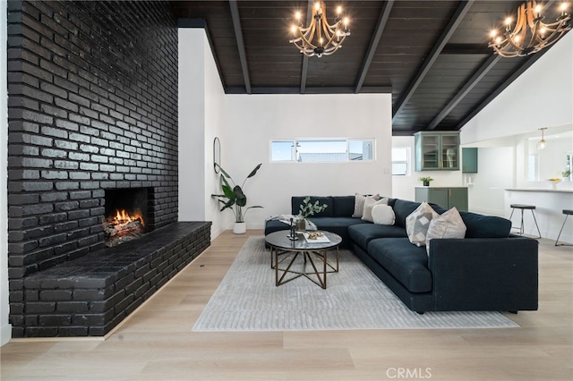 3533 Deerford St, Lakewood, CA 90712 - living area with a notable chandelier, lofted ceiling with beams, a fireplace, wood ceiling, and wood finished floors