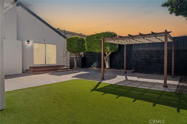 3533 Deerford St, Lakewood, CA 90712 - yard at dusk with entry steps, a fenced backyard, a pergola, and a patio
