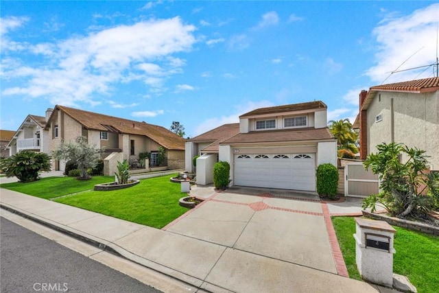 25 Bennington, Irvine, CA 92620 - view of front facade featuring a residential view, stucco siding, driveway, a front lawn, and a garage
