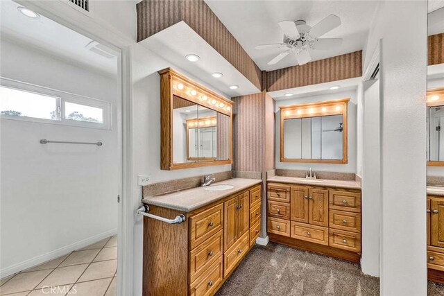 25 Bennington, Irvine, CA 92620 - full bath featuring two vanities, ceiling fan, a sink, and wallpapered walls