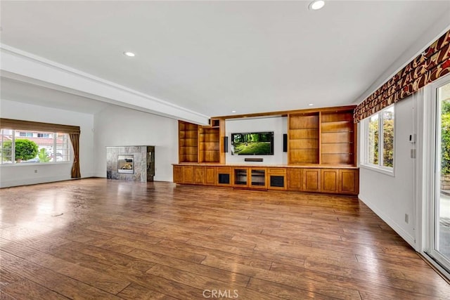 25 Bennington, Irvine, CA 92620 - unfurnished living room with a premium fireplace, wood-type flooring, baseboards, and recessed lighting