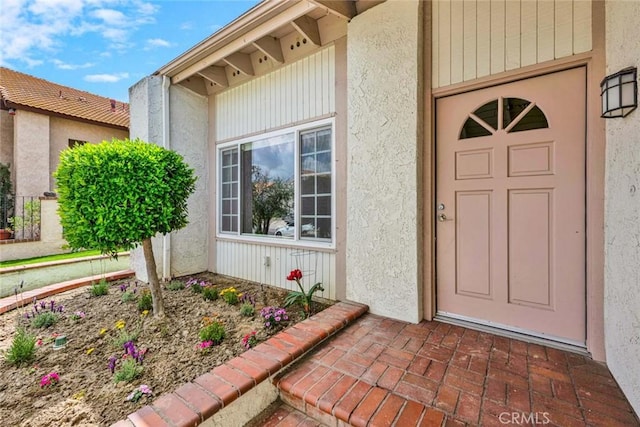 25 Bennington, Irvine, CA 92620 - doorway to property featuring stucco siding