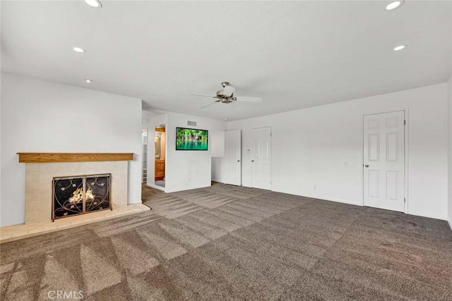 25 Bennington, Irvine, CA 92620 - unfurnished living room featuring a tiled fireplace, a ceiling fan, carpet, and recessed lighting