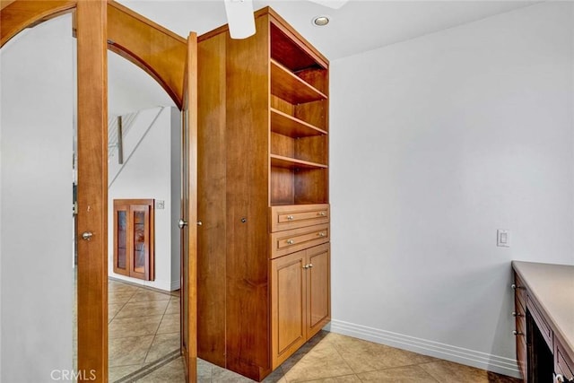 25 Bennington, Irvine, CA 92620 - corridor with light tile patterned floors, baseboards, recessed lighting, and arched walkways