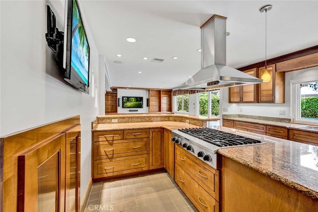 25 Bennington, Irvine, CA 92620 - kitchen with brown cabinetry, visible vents, stainless steel gas cooktop, light stone counters, and island exhaust hood
