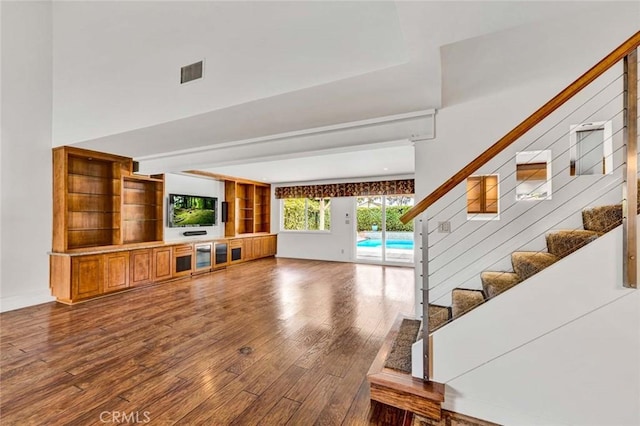 25 Bennington, Irvine, CA 92620 - living room featuring visible vents, wood finished floors, and stairs
