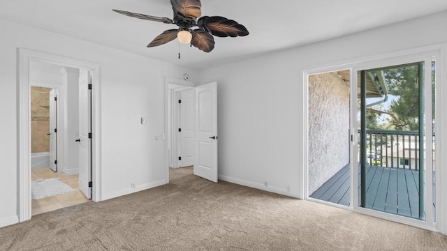 unfurnished bedroom featuring carpet flooring, ceiling fan, access to exterior, baseboards, and ensuite bathroom