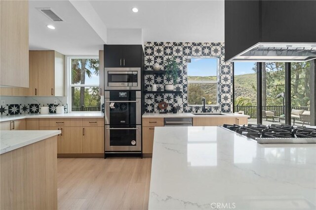 115 Buckskin Rd, Bell Canyon, CA 91307 - kitchen featuring a sink, light brown cabinetry, tasteful backsplash, light stone counters, and recessed lighting