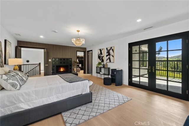 115 Buckskin Rd, Bell Canyon, CA 91307 - bedroom with french doors, access to outside, wood finished floors, a chandelier, and recessed lighting
