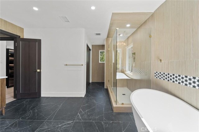 115 Buckskin Rd, Bell Canyon, CA 91307 - bathroom featuring marble finish flooring, a freestanding tub, a shower stall, recessed lighting, and baseboards