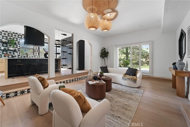 115 Buckskin Rd, Bell Canyon, CA 91307 - living room with arched walkways and wood finished floors