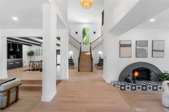 115 Buckskin Rd, Bell Canyon, CA 91307 - foyer entrance with wood finished floors, recessed lighting, baseboards, beam ceiling, and a tiled fireplace