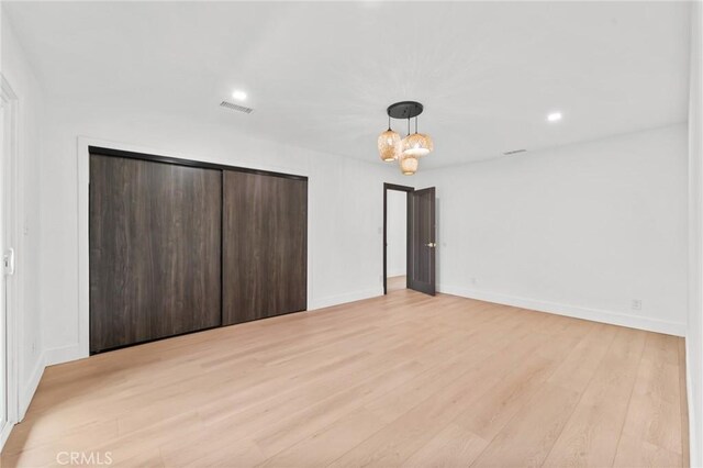 115 Buckskin Rd, Bell Canyon, CA 91307 - unfurnished bedroom with light wood-style floors, a closet, recessed lighting, baseboards, and a chandelier