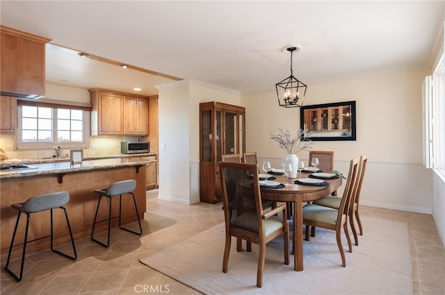 6528 Abbottswood Dr, Rancho Palos Verdes, CA 90275 - dining area featuring ornamental molding, baseboards, a notable chandelier, and light tile patterned floors
