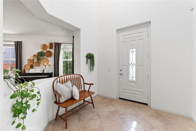 foyer entrance featuring baseboards