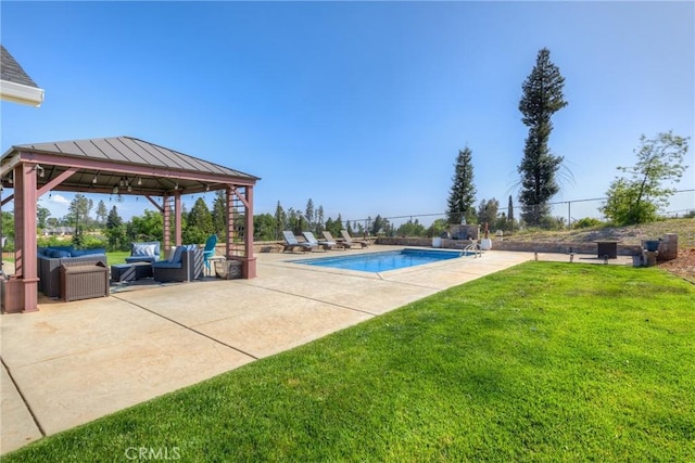 view of pool with a patio area, a gazebo, a fenced in pool, a yard, and outdoor lounge area
