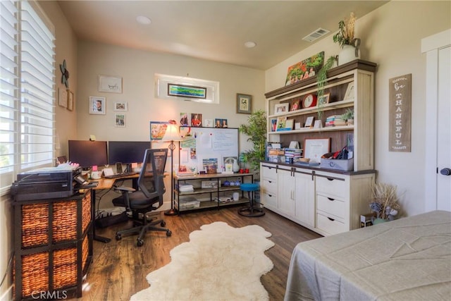 bedroom with recessed lighting, wood finished floors, and visible vents