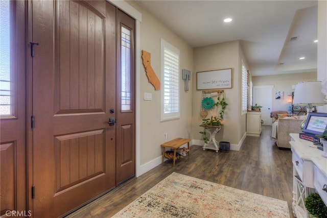 entrance foyer with recessed lighting, baseboards, dark wood finished floors, and visible vents