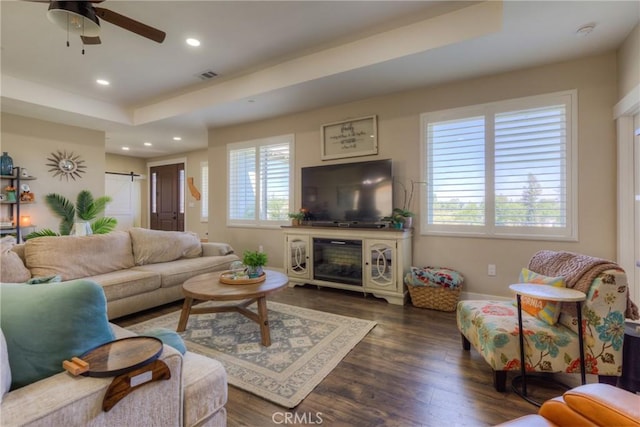 living area featuring a healthy amount of sunlight, recessed lighting, wood finished floors, and visible vents