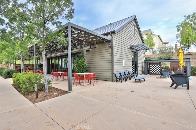 view of patio featuring fence and outdoor dining space