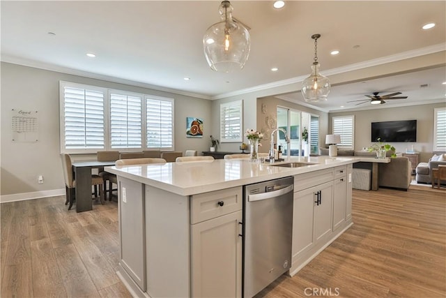 2454 Nova Way, Corona, CA 92883 - kitchen featuring dishwasher, a sink, open floor plan, decorative light fixtures, and ornamental molding