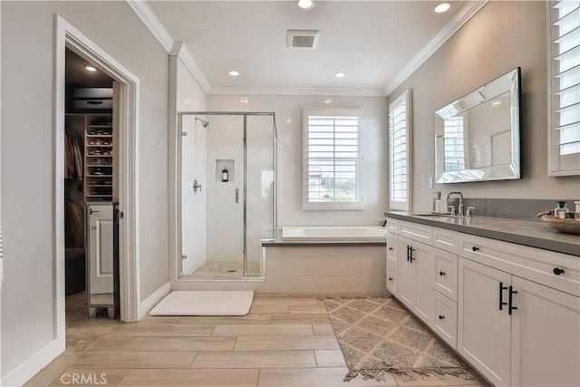2454 Nova Way, Corona, CA 92883 - bathroom featuring a stall shower, ornamental molding, a garden tub, a walk in closet, and vanity