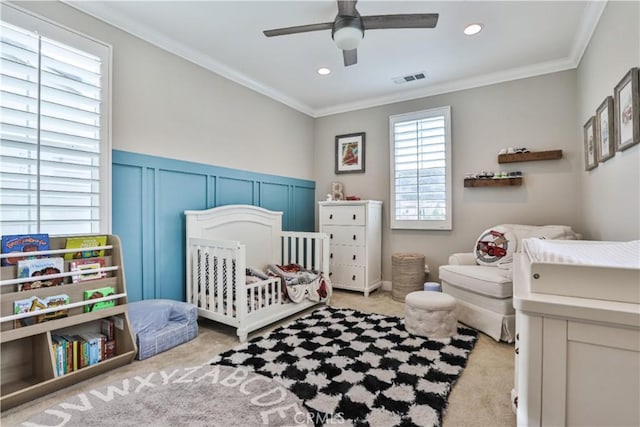2454 Nova Way, Corona, CA 92883 - bedroom featuring carpet flooring, a crib, crown molding, recessed lighting, and a wainscoted wall