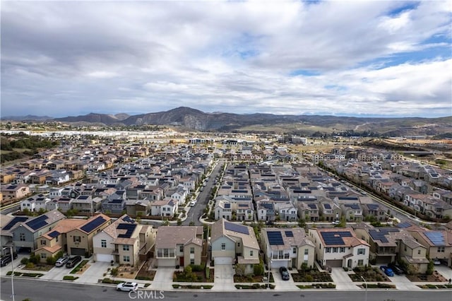 drone / aerial view featuring a residential view and a mountain view
