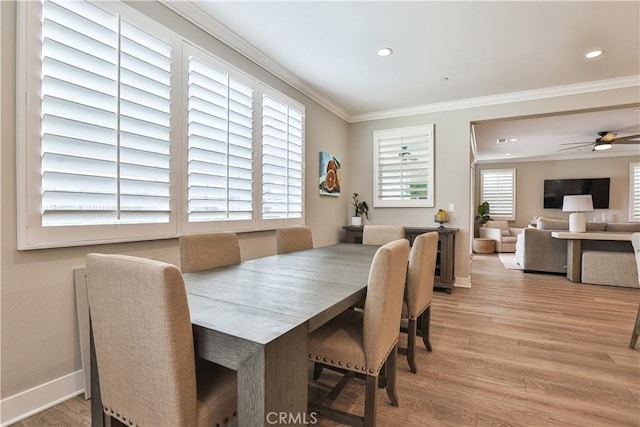 dining space with ornamental molding, recessed lighting, and wood finished floors