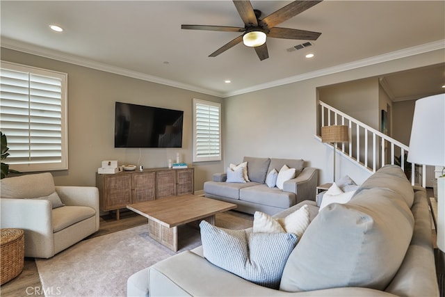 2454 Nova Way, Corona, CA 92883 - living room with light wood-style floors, a ceiling fan, recessed lighting, ornamental molding, and stairs