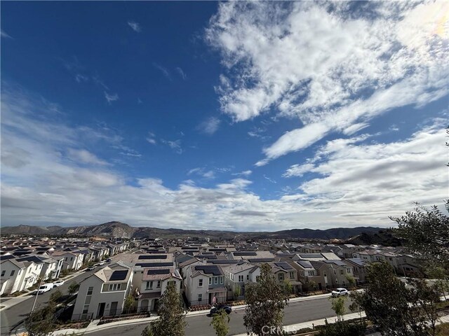 aerial view with a mountain view and a residential view