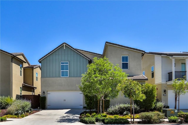 2454 Nova Way, Corona, CA 92883 - view of front of house featuring board and batten siding, an attached garage, concrete driveway, and stucco siding