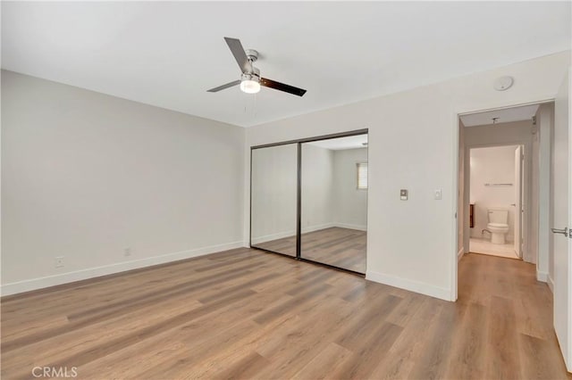 444 Obispo Ave Unit 201, Long Beach, CA 90814 - unfurnished bedroom featuring a closet, light wood-style floors, baseboards, and a ceiling fan