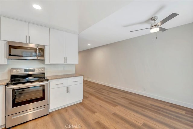 444 Obispo Ave Unit 201, Long Beach, CA 90814 - kitchen featuring stainless steel appliances, light wood finished floors, white cabinets, baseboards, and recessed lighting