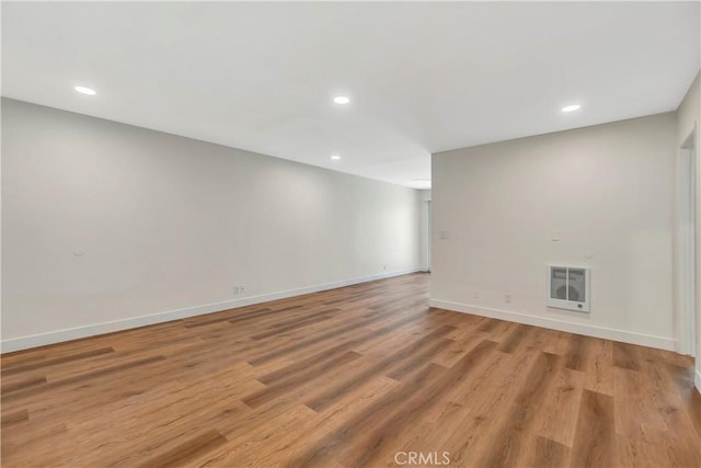 444 Obispo Ave Unit 201, Long Beach, CA 90814 - empty room featuring heating unit, recessed lighting, baseboards, and light wood-style floors