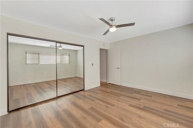 444 Obispo Ave Unit 201, Long Beach, CA 90814 - unfurnished bedroom featuring wood finished floors, a closet, baseboards, and a ceiling fan
