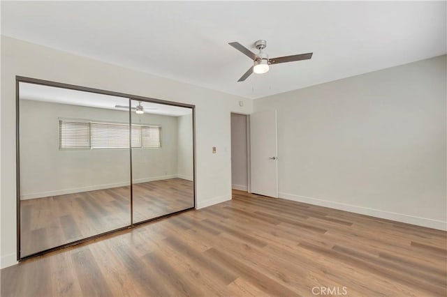 444 Obispo Ave Unit 201, Long Beach, CA 90814 - unfurnished bedroom with light wood-style flooring, a closet, and a ceiling fan