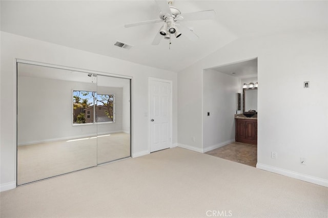 8 Carey Ct, Aliso Viejo, CA 92656 - unfurnished bedroom featuring vaulted ceiling, visible vents, a closet, baseboards, and carpet flooring