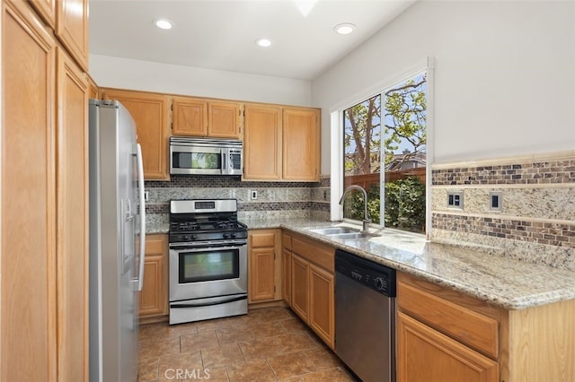 8 Carey Ct, Aliso Viejo, CA 92656 - kitchen featuring a sink, recessed lighting, backsplash, light stone counters, and appliances with stainless steel finishes