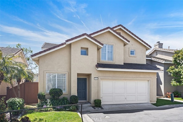 8 Carey Ct, Aliso Viejo, CA 92656 - traditional home featuring a garage, concrete driveway, stucco siding, and fence