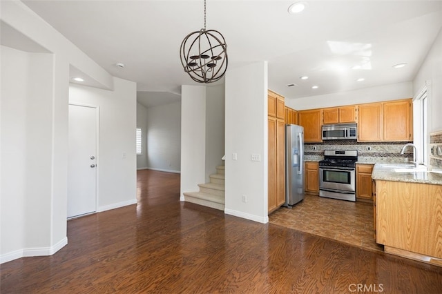 8 Carey Ct, Aliso Viejo, CA 92656 - kitchen featuring recessed lighting, dark wood-style floors, a sink, decorative backsplash, and appliances with stainless steel finishes