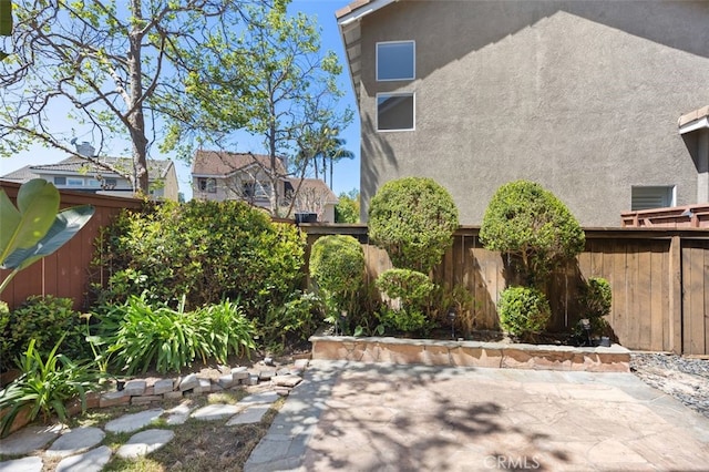 8 Carey Ct, Aliso Viejo, CA 92656 - view of yard featuring a fenced backyard and a patio