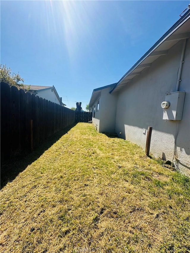view of yard featuring a fenced backyard