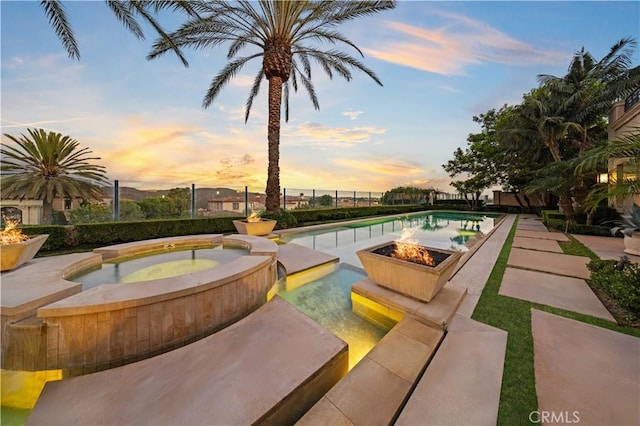 9 Shoreridge, Newport Coast, CA 92657 - view of swimming pool with an outdoor fire pit, a patio area, and a pool with connected hot tub