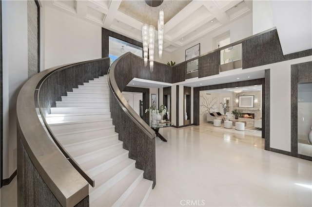 9 Shoreridge, Newport Coast, CA 92657 - stairs with beamed ceiling, coffered ceiling, and a towering ceiling