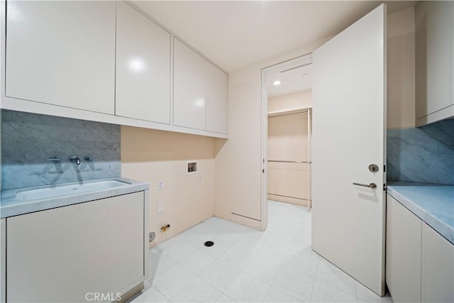 9 Shoreridge, Newport Coast, CA 92657 - washroom with cabinet space, a sink, washer hookup, and gas dryer hookup